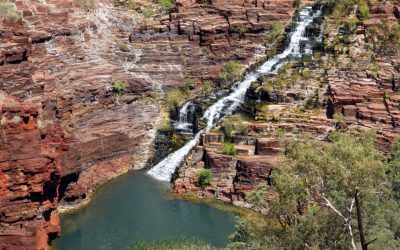 High angle shot of cascades flushing over rock formations. Fortesque falls. Karijini National Park, Western Australia, Australia